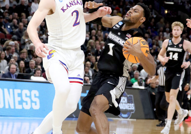 NCAA's: Jayhawks put the squeeze on Friars to end run, 66-61